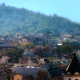 Rooftops in front of a forested hillside in Bulgaria