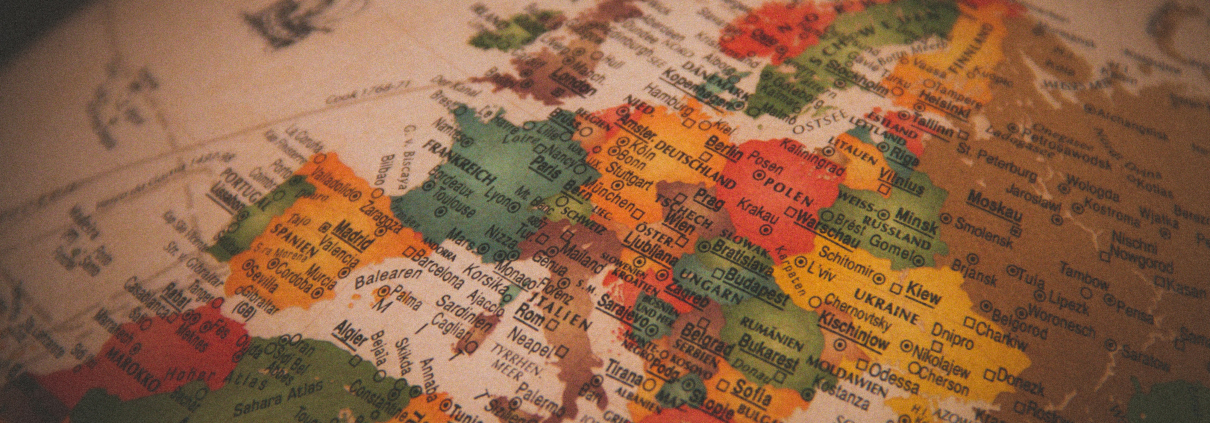 A close-up view of a globe showing Europe, highlighting countries including Spain, France, Germany, and parts of Eastern Europe with visible cities like Madrid, Paris, Berlin, and Kiev.