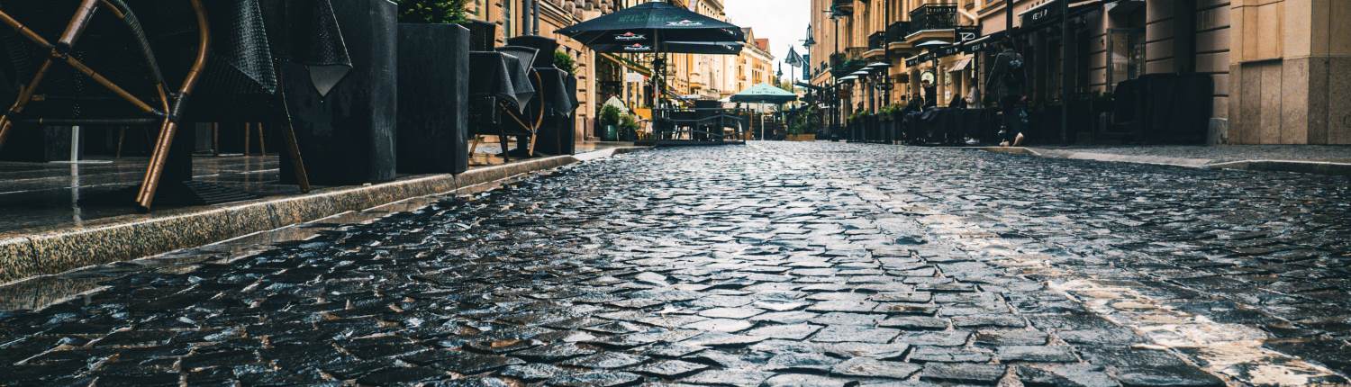 A close-up of a cobblestone street in a European city