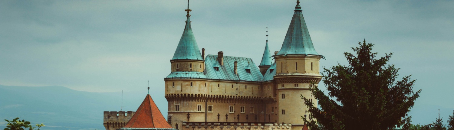 The green-rooved upper levels of a medieval castle in Bojnice, Slovakia